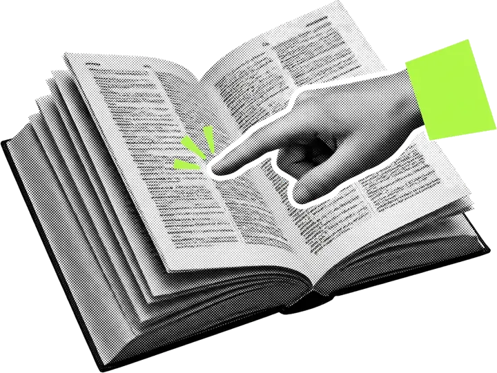 Un dito indica una voce in un dizionario aperto